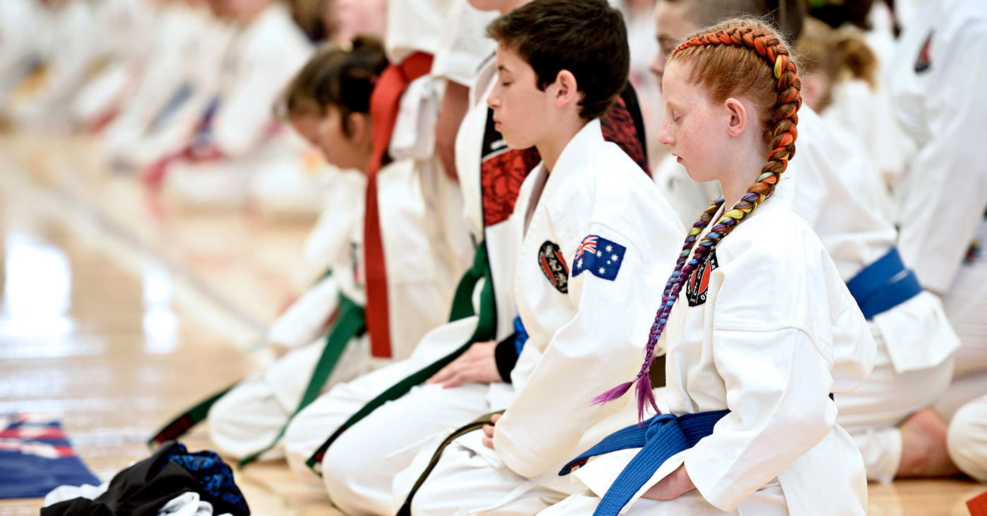 the art of breathing. kids leaning on the floor, learning to effectively breathe the art of breathing. kids leaning on the floor, learning to effectively breathe